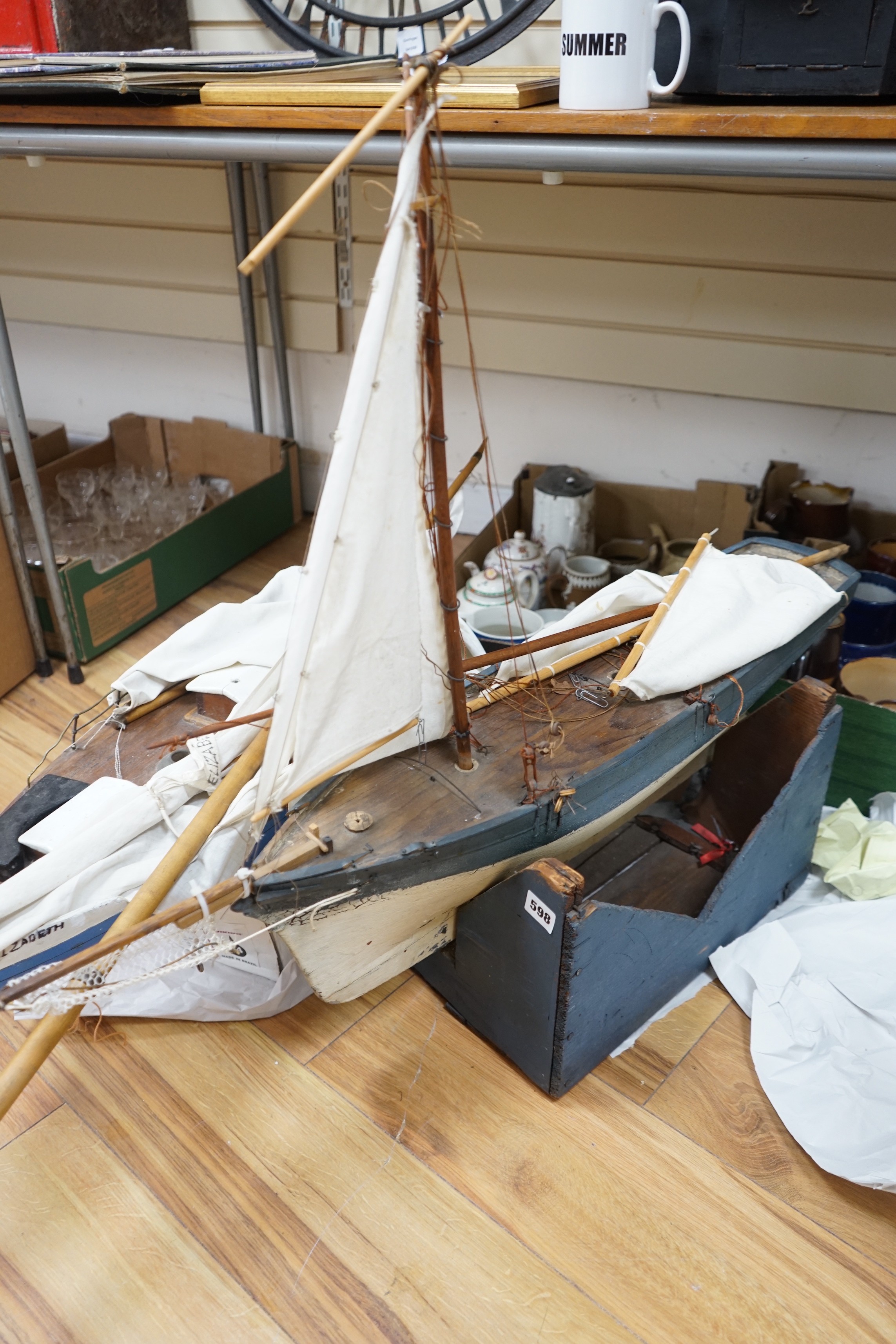 Two large over-painted pond yachts, largest 91cms